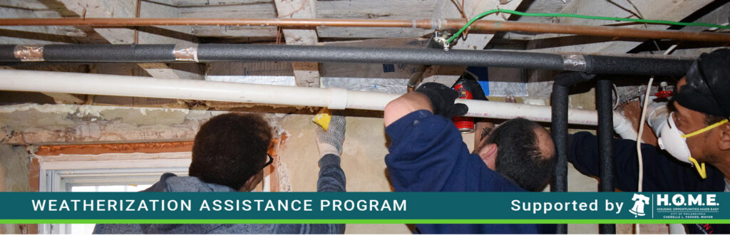 Contractors insulating basement ceiling